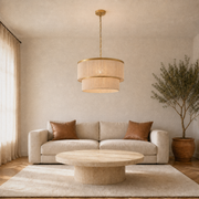 Living room | Cigogne satin brass two-tier drum chandelier above a coffee table