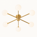 Front | brushed brass six-globe semi-flush fixture in a clean underside studio view