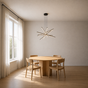 At scale | matte black six-bar chandelier shown beside a full-height dining-room window