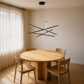Second dining-room angle | matte black six-bar integrated LED chandelier over a pale oak table