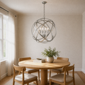 Dining room | Brushed nickel four-light globe chandelier above a pale oak dining table