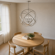 Dining room | Corner view of the brushed nickel globe chandelier above a pale oak table
