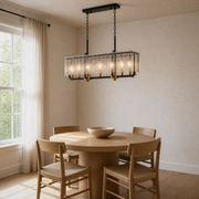 Angle in room | three-quarter view of the pendant over a round oak dining table