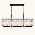Front | seven brass sockets and clear rippled glass slats on a matte-black rectangular pendant