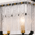 Close view | rippled clear glass slats and a brass socket on the pendant
