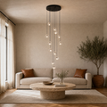 In a room | black crystal pendant cluster over a living room coffee table