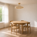 Scale view | antique brass semi-flush mount against a full-height dining-room window and table
