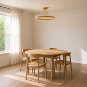 Scale view | antique brass semi-flush mount against a full-height dining-room window and table