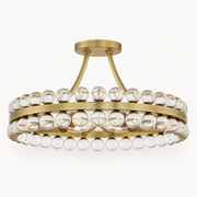 Studio front | antique brass ring with clear crystal spheres, round canopy, and curved mounting rods