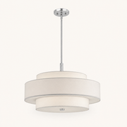 Studio low angle | off-white three-drum chandelier with chrome-tone rod and canopy