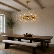 In a room | warm gold-tone 12-light crystal ring chandelier in a cool limewash dining room with beams