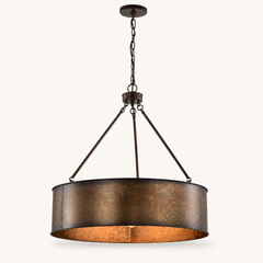 Front | studio front of the weathered steel drum with warm gold interior