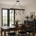 Scale view | eight-bulb pendant beneath a full-height glass doorway