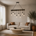 Living room | eight-bulb linear pendant over a travertine coffee table