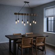 Cool dining room | eight-bulb pendant above a dark dining table
