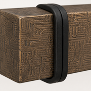 Texture close-up | weathered wood-look metal surface and black strap