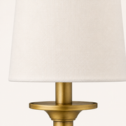 Texture | close view of the plain off-white linen weave and brass bobeche