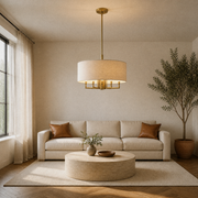 In a room | the chandelier over a travertine coffee table in a warm living room with an olive tree