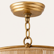 Hardware | close view of distressed-gold canopy and linked chain above the rope tiers