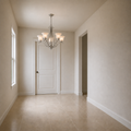Scale | brushed nickel five-light chandelier hanging at true size in front of a full-height paneled doorway