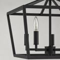 Texture | marnau Lampaul 4-Light Lantern Chandelier close view of its matte black steel bars and candle socket