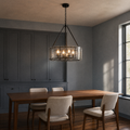 In a room | living-room dining view of the chandelier against cool blue-gray walls and walnut furnishings