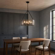 In a room | living-room dining view of the chandelier against cool blue-gray walls and walnut furnishings