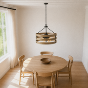 Dining room angle | High view of the three-band drum chandelier over a round oak table