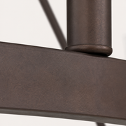 Bronze close-up | rubbed metal ring and round candle-sleeve collar