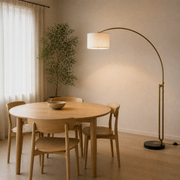 Room 1 angle | antique-brass arched floor lamp in the oak dining room