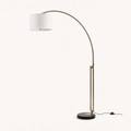 Studio three-quarter | black marble base, dual brass rods, and cotton drum from an angle