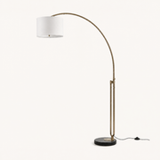 Studio three-quarter | black marble base, dual brass rods, and cotton drum from an angle