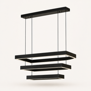 Studio three-quarter | black rectangular LED chandelier showing canopy depth, four cords, and three stepped frames