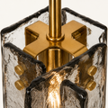 Hardware | close view of the brass cross bracket holding the glass panels