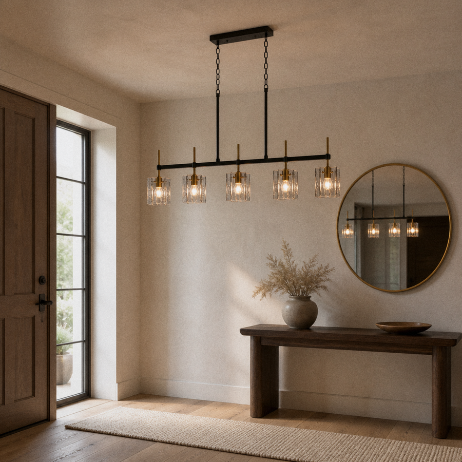 Entry | the same pendant hung lengthwise above an entryway console table with a round mirror