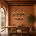 Room | two-tier light woodgrain wagon wheel chandelier over a reclaimed-oak dining table in a terracotta room