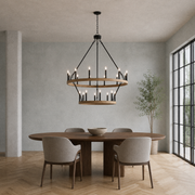 Room | light woodgrain two-tier chandelier over an oval dining table in a cool limewash salon