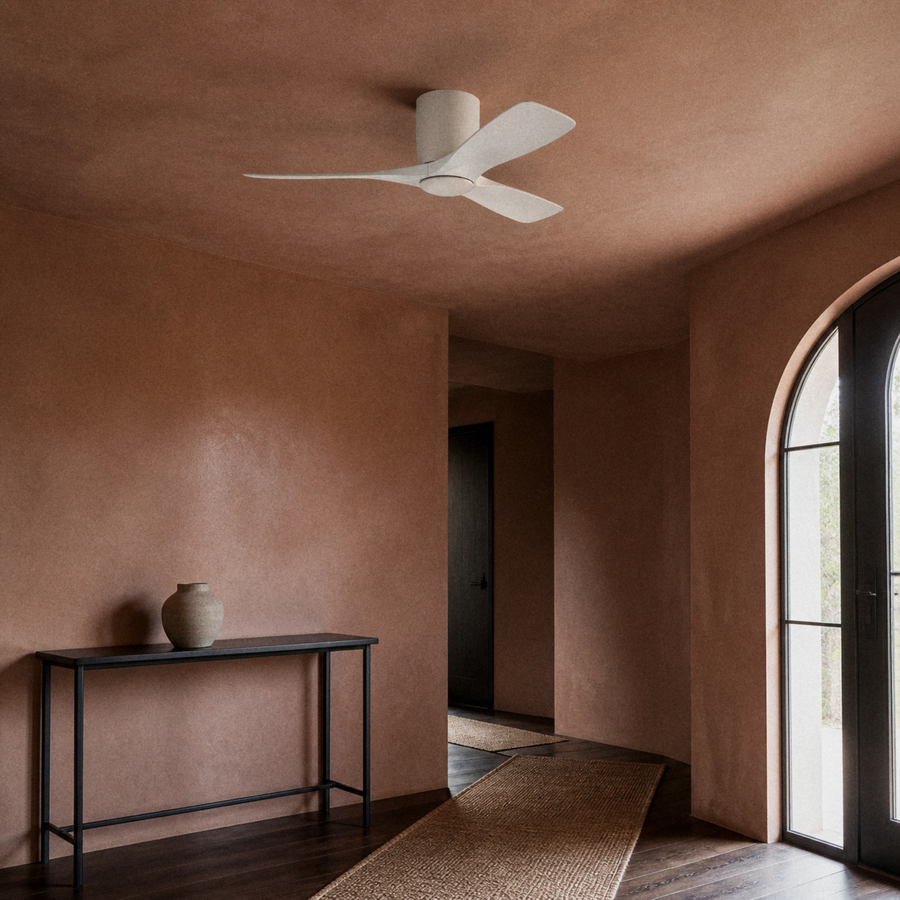 In a room | matte white three-blade LED ceiling fan in a terracotta-plaster entry hall