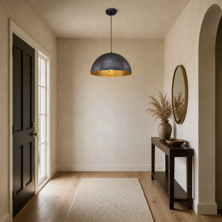 In an entryway | the dome pendant hanging in the walkway beside a console table and mirror