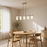 Warm dining room angle | brushed nickel 5-light linear pendant over a pale-oak table