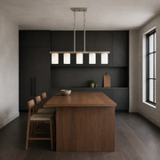 Cool kitchen | brushed nickel 5-light linear pendant over a walnut island