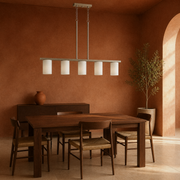 Terracotta dining room | brushed nickel 5-light linear pendant over a walnut table