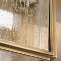 Close detail | bubbled clear seeded glass and natural brass channel