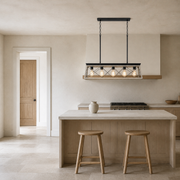 Scale | whitewashed wood and graphite-black chandelier beside a full-height doorway