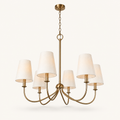 Underside angle | six-light warm brass chandelier showing the canopy, chain, hub, and curved arms