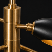 Hardware close-up | brass center sleeve, arm junction, stepped collar and matte-black shade