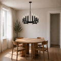 Scale view | dark aged-zinc chandelier with an uncropped floor-to-ceiling doorway and round oak table
