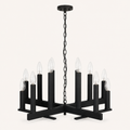 Studio front | dark aged-zinc open X-frame chandelier with twelve upright candle sockets, round canopy and chain