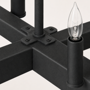 Macro detail | textured dark aged-zinc bar, center join plate, screws and candle socket