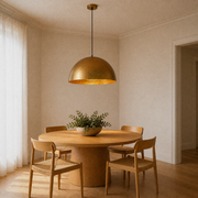 Room | oblique view of the hammered gold dome over a round oak dining table
